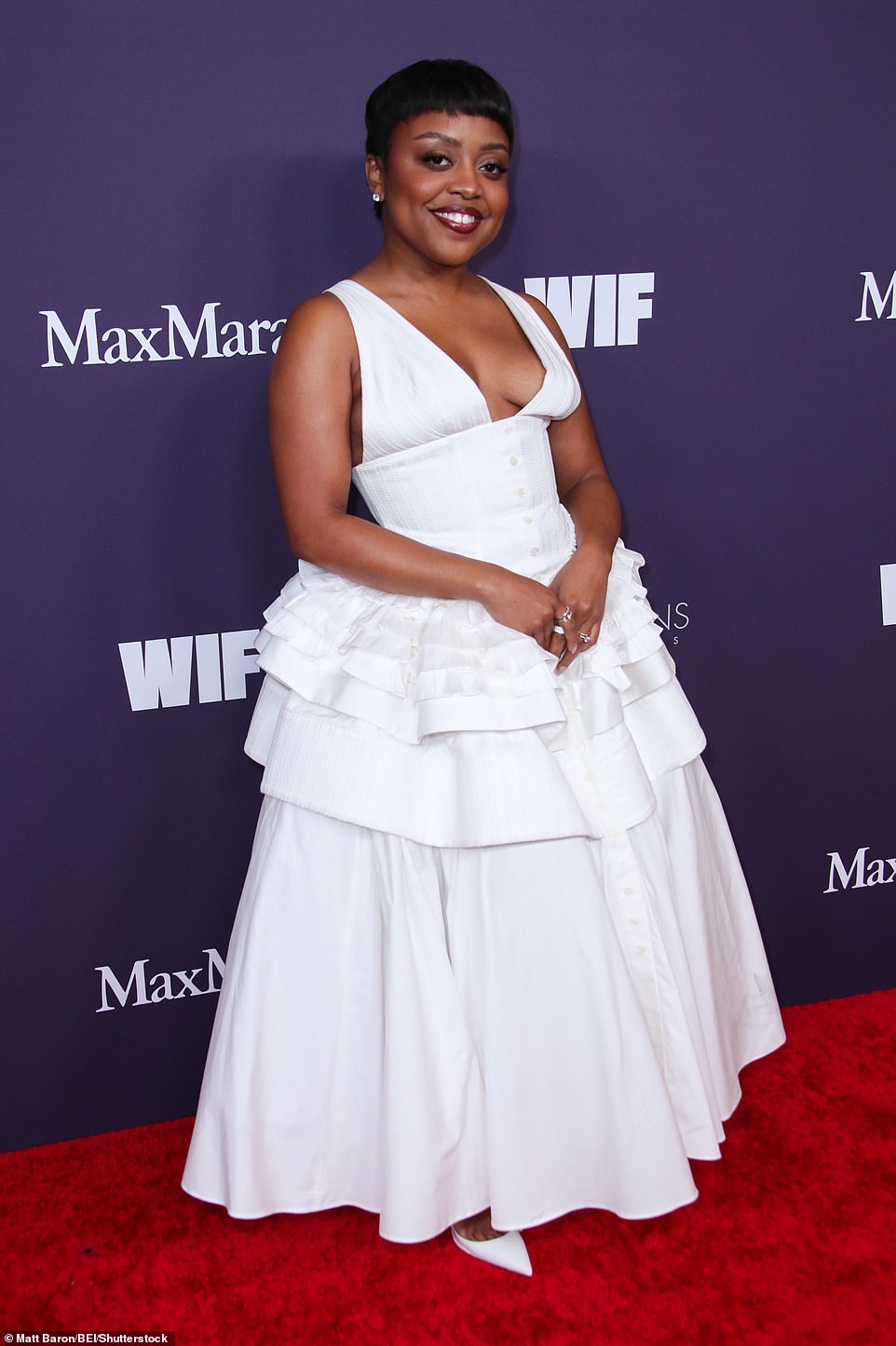 Brunson rocked a bold berry lip and classic white high heels