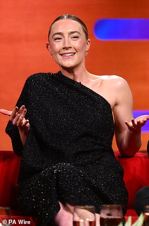 The Irish actress was responding to a joke made by Paul, with he, Denzel and Eddie, laughing at the idea one would use a phone to defend themselves in the wake of an attack