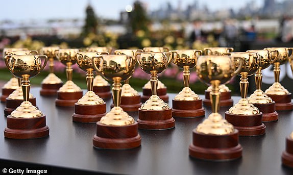 MELBOURNE, AUSTRALIA - NOVEMBER 02: Miniature Melbourne Cups are seen at the Melbourne Cup barrier draw during 2024 Penfolds Victoria Derby Day at Flemington Racecourse on November 02, 2024 in Melbourne, Australia. (Photo by Vince Caligiuri/Getty Images)