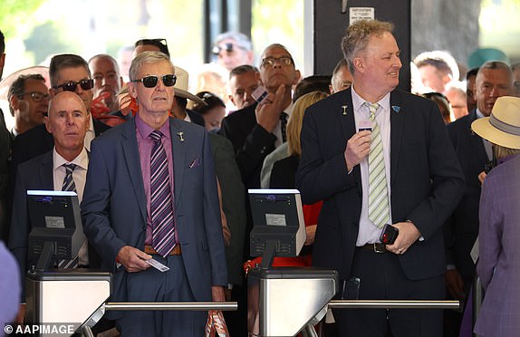 Racegoers queue to attend the 2024 Melbourne Cup at Flemington Racecourse in Melbourne, Tuesday, November 5, 2024. (AAP Image/Con Chronis) NO ARCHIVING, EDITORIAL USE ONLY