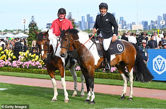 MELBOURNE, AUSTRALIA - NOVEMBER 02: Billy Slater on the pony for Channel 9's Melbourne Cup coverage poses with clerk of Course Shane Patterson during 2024 Penfolds Victoria Derby Day at Flemington Racecourse on November 02, 2024 in Melbourne, Australia. (Photo by Vince Caligiuri/Getty Images) 14034571