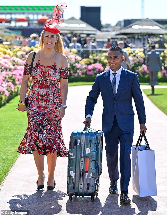 MELBOURNE, AUSTRALIA - NOVEMBER 05: Karis Teetan and partner Xavier Cottereau arrive during Melbourne Cup Day at Flemington Racecourse on November 05, 2024 in Melbourne, Australia. (Photo by Vince Caligiuri/Getty Images)