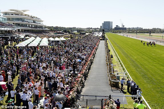 MELBOURNE, AUSTRALIA - NOVEMBER 05: Crowds watch race 1 Darley Maribyrnong Plate during Melbourne Cup Day at Flemington Racecourse on November 05, 2024 in Melbourne, Australia. (Photo by Darrian Traynor/Getty Images)