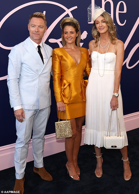 Michelle Payne (c) poses with Ronan and Storm Keating   at the 2024 Melbourne Cup at Flemington Racecourse in Melbourne, Tuesday, November 5, 2024. (AAP Image/Con Chronis) NO ARCHIVING, EDITORIAL USE ONLY