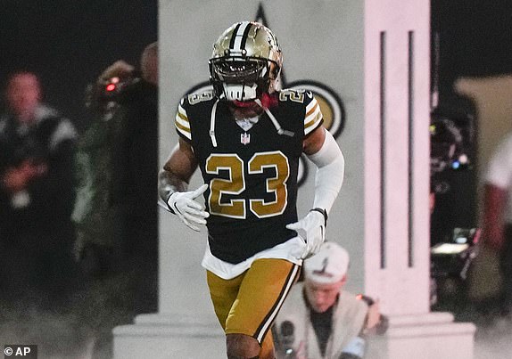 New Orleans Saints cornerback Marshon Lattimore (23) runs onto the field during player introductions before an NFL football game against the Denver Broncos in New Orleans, Thursday, Oct. 17, 2024. The Broncos won 33-10. (AP Photo/Gerald Herbert)