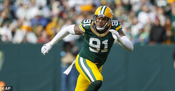 Green Bay Packers defensive end Preston Smith (91) rushes during a NFL game against the Arizona Cardinals Sunday, Oct. 13, 2024, in Green Bay, Wis. (AP Photo/Jeffrey Phelps