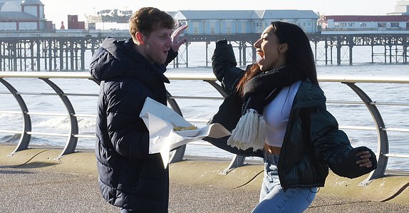 Jamie Borthwick and Michelle Tsiakkas PICTURE BY CHRIS NEILL - 07930-353682 - STRICTLY COME DANCING HAS ARRIVED IN BLACKPOOL, A COLD AND FOGGY THURSDAY MORNING SAW JAMIE AND MICHELLE DANCING ON THE PROM WITH A BAG OF WARM CHIS !!!!!