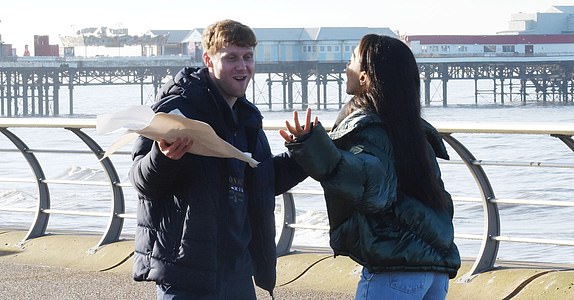 Jamie Borthwick and Michelle Tsiakkas PICTURE BY CHRIS NEILL - 07930-353682 - STRICTLY COME DANCING HAS ARRIVED IN BLACKPOOL, A COLD AND FOGGY THURSDAY MORNING SAW JAMIE AND MICHELLE DANCING ON THE PROM WITH A BAG OF WARM CHIS !!!!!