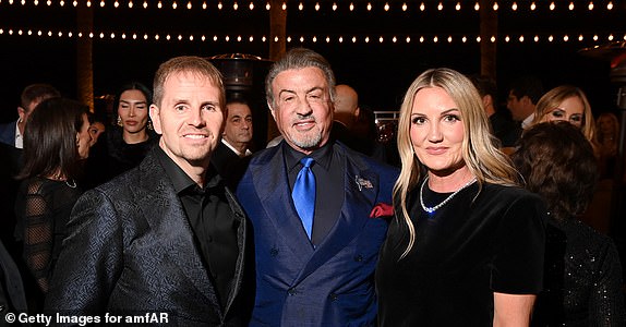 LAS VEGAS, NEVADA - NOVEMBER 22: (L-R) Chris Mastronardi, Sylvester Stallone and Tanya Mastronardi attend amfAR Las Vegas Presented by Paramount at Wynn Las Vegas on November 22, 2024 in Las Vegas, Nevada. (Photo by Ryan Emberley/amfAR/Getty Images for amfAR)