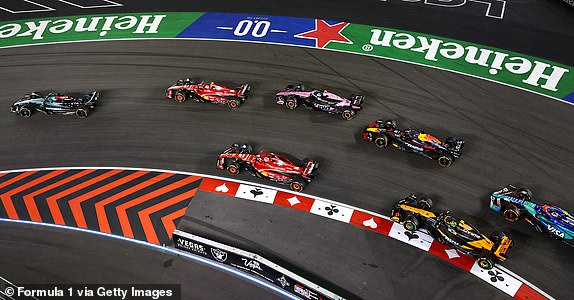 LAS VEGAS, NEVADA - NOVEMBER 23: George Russell of Great Britain driving the (63) Mercedes AMG Petronas F1 Team W15 leads the field into the first corner at the start of the race during the F1 Grand Prix of Las Vegas at Las Vegas Strip Circuit on November 23, 2024 in Las Vegas, Nevada. (Photo by Clive Rose - Formula 1/Formula 1 via Getty Images)