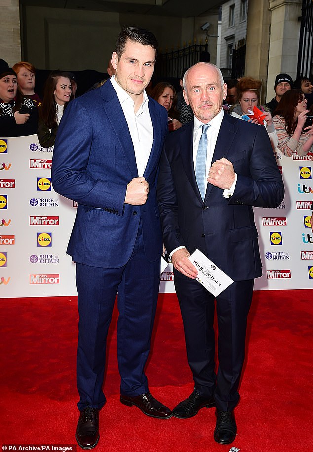 She  dated boxing coach Shane in 2018, a year before finding fame on Love Island, when she worked as ring girl and he was commentating on a match (Shane and Barry pictured in 2014)