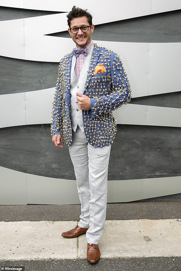 Rob Mills wasn't immune from critique as he posed at the Melbourne Cup the same year, with the musical theatre performer donning a perplexing jacket emblazoned with tiny medals