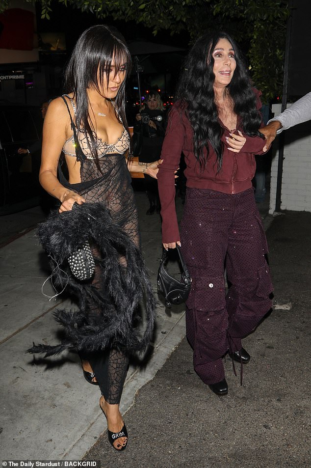 Stark showed off her fab figure in a sheer, see-through spider-web dress