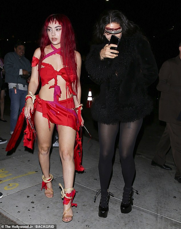 The Brat superstar channelled her inner devil in the daring all-red look, while Rosalia appeared to have fallen victim to a zombie attack with her blood-covered face