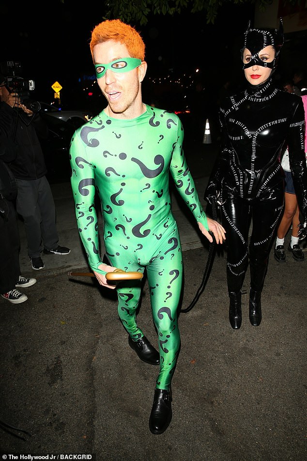 Nina Dobrev and her fiancé Shaun White channelled their inner villains, by dressing up as Catwoman from Batman Returns, and The Riddler from its sequel, Batman Forever