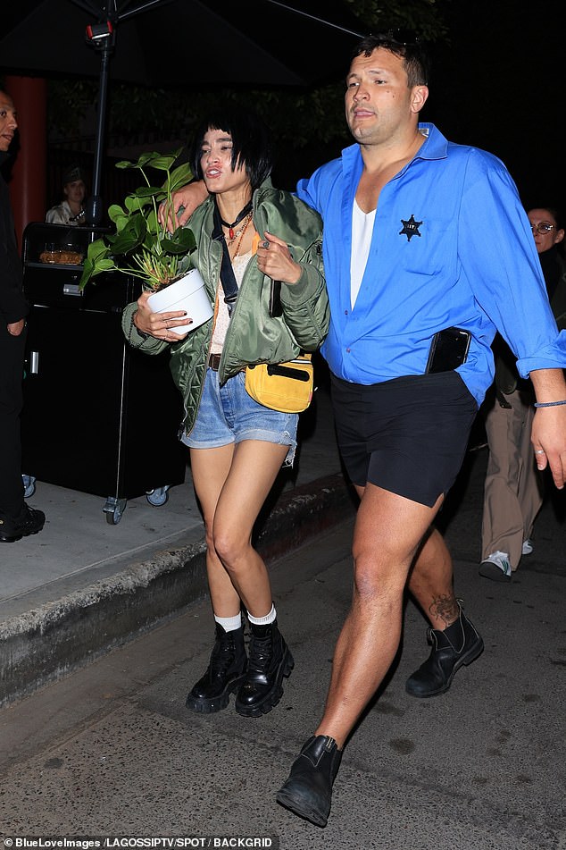 Sofia Boutella put on a leggy display in tiny denim shorts and a green bomber jacket as she made a bleary-eyed exit from the party