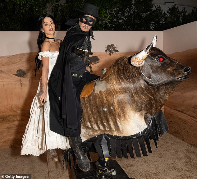 Rita Ora, 33, and husband Taika Waititi, 49 rode a mechanical bull at Vas J Morgan and Michael Braun's star-studded Halloween party in West Hollywood on Thursday night