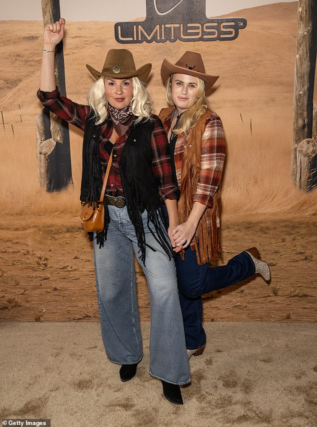 Rebel (R) and wife Ramona (L) wore matching cowgirl costumes and posed up a storm before taking a turn on the bull