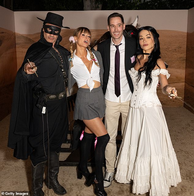 Paris was also joined at the event by her hunky husband Carter Reum, 43 (R)