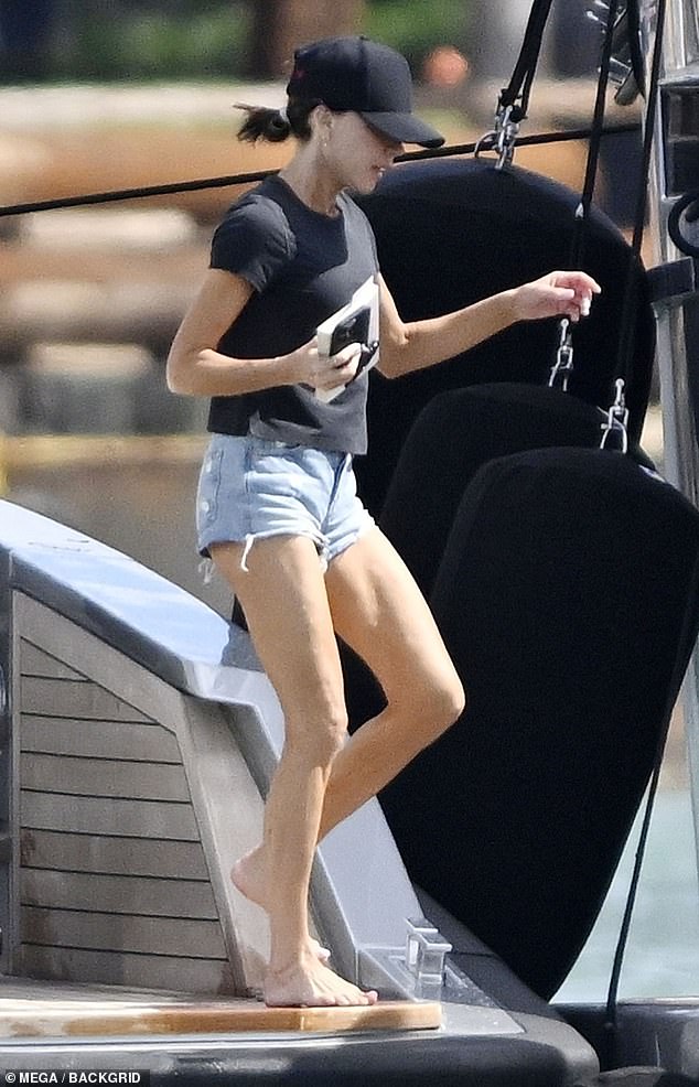 Victoria juggled her book and mobile phone as she jumped back onto the boat