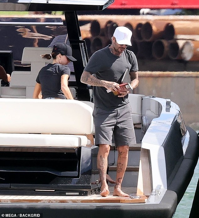 The couple, complete with their books, headed to land on a smaller speed boat