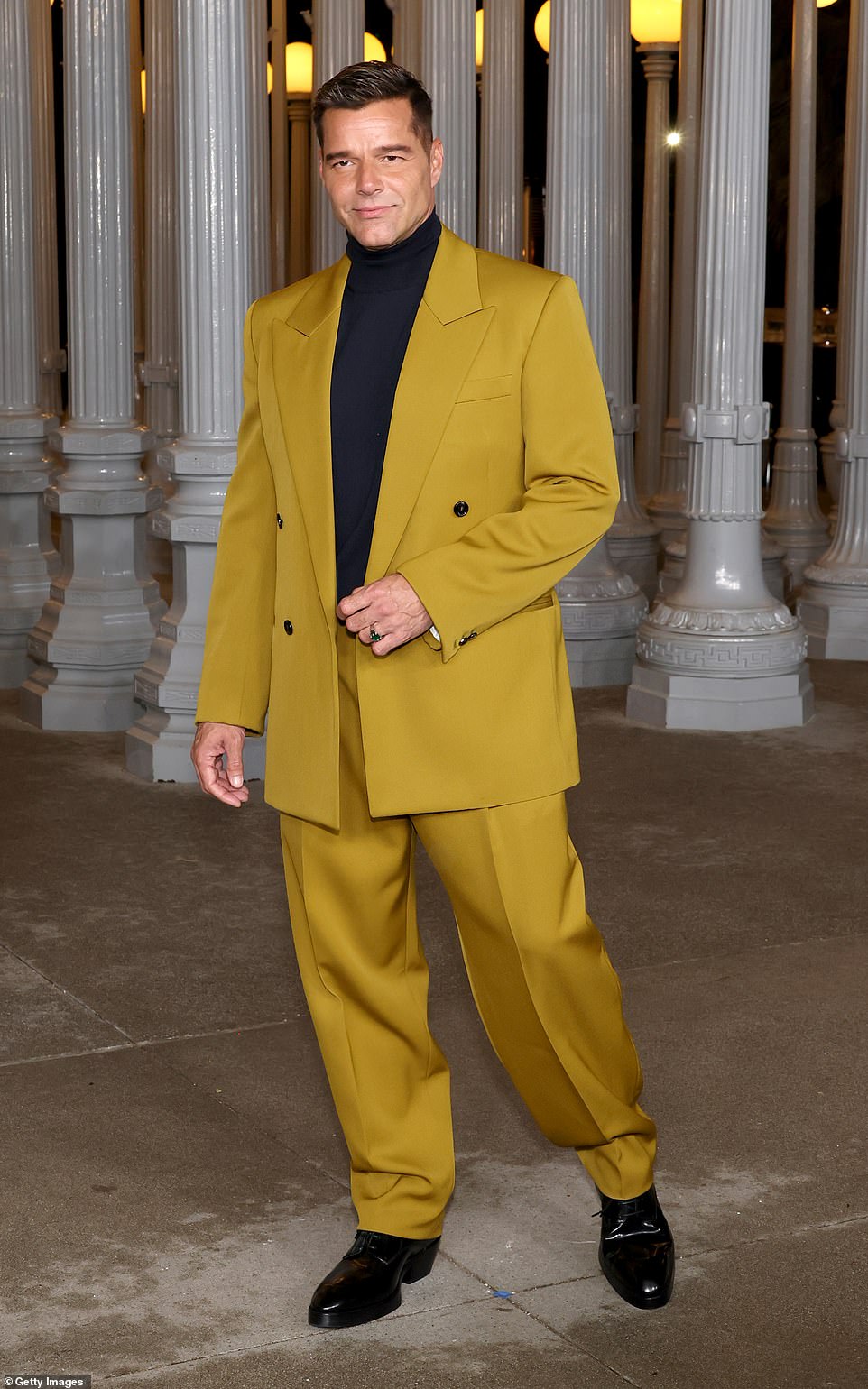 Ricky Martin looked dapper in a mustard yellow suit, which he paired with a black turtleneck and shiny dress shoes