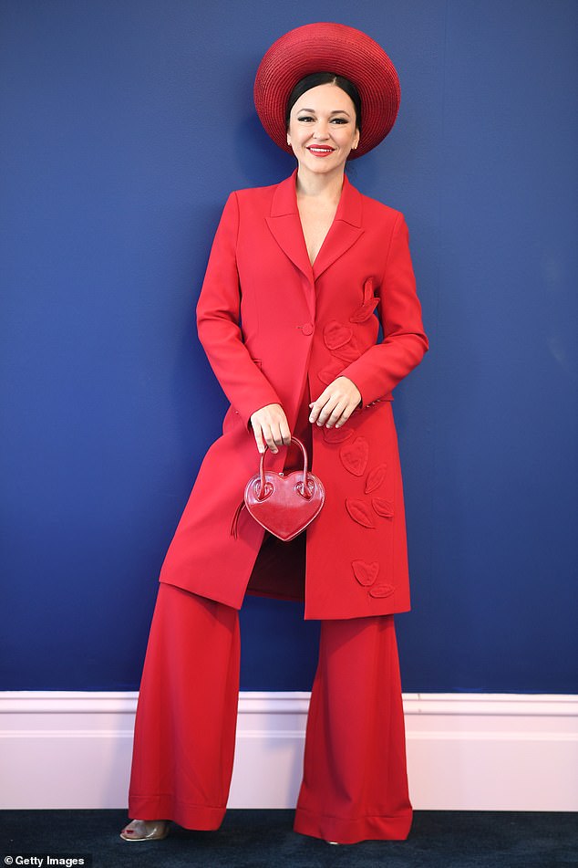 Fashion racing enthusiast Viera Macikova showed off her unique sense of style in a red jacket embellished with love hearts, which she styled with wide-leg trousers