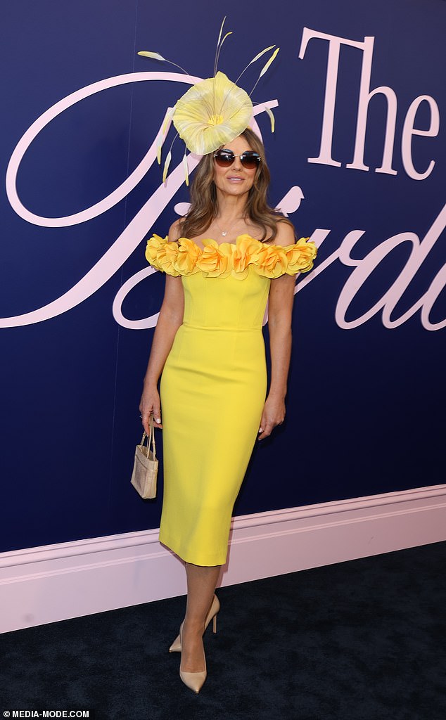 While a whole host of celebrities stepped out in rouge outfits on the big day, Liz, 59, made her very own fashion statement as she strutted her stuff in a yellow ensemble