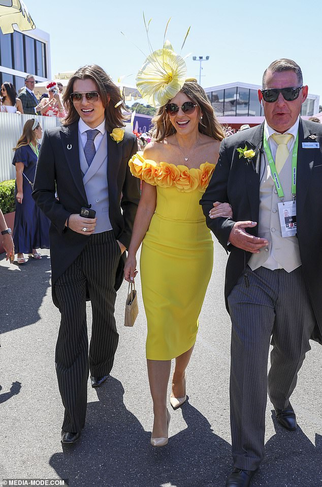 She was seen being assisted by a member of staff as she strutted her stuff in her high heels at the Australian event