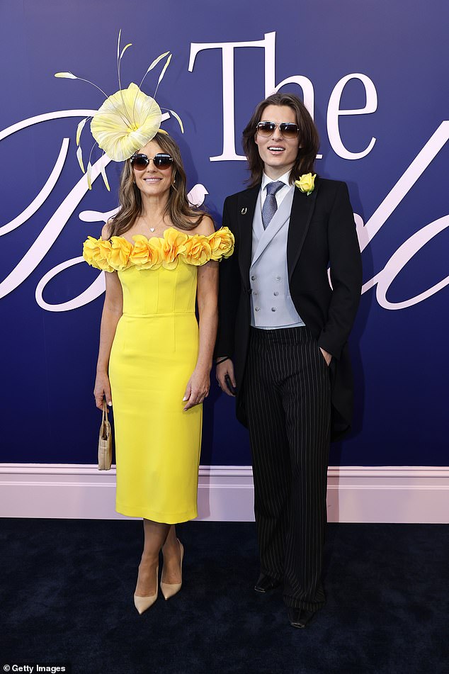 Arriving at the world-famous 'Birdcage', Liz gave herself a few extra inches with a pair of cream heels and toted her essentials in a colour coordinated handbag