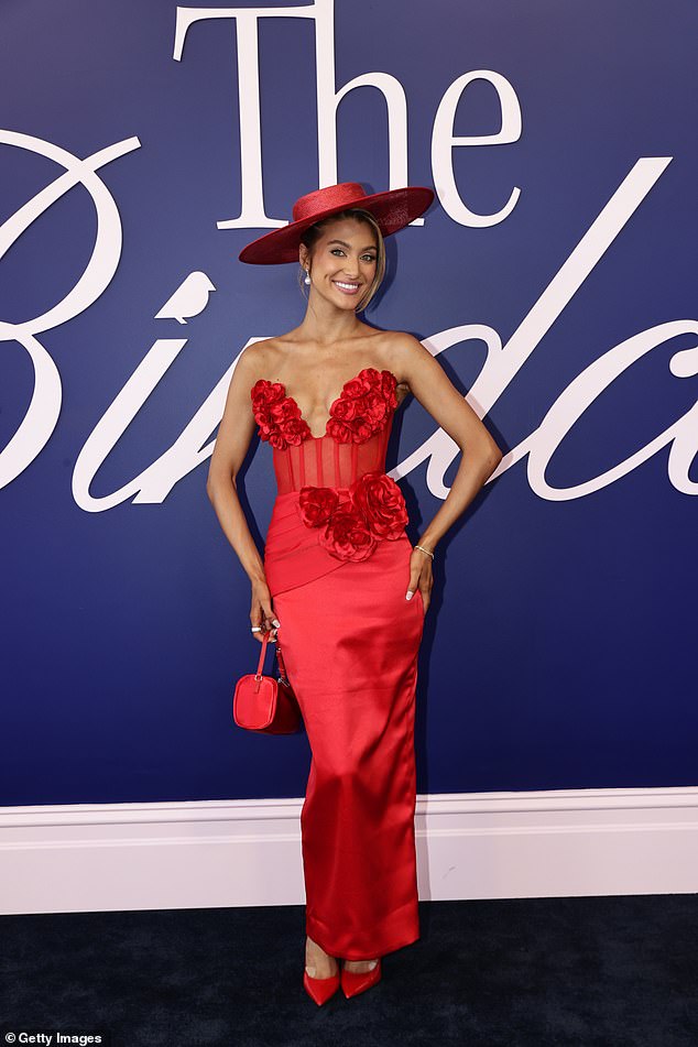 Hannah Del Sasso kept in line with the apparent all-red theme in a stunning satin ensemble on the big day