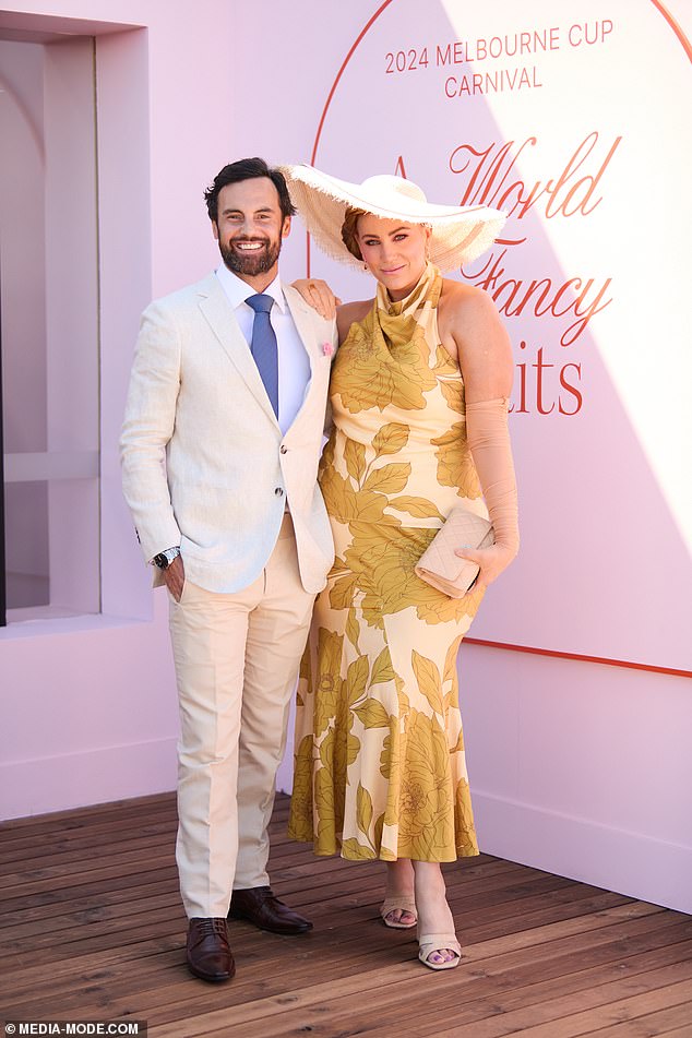 Jules Robinson looked effortlessly stylish in a halter-neck cream and green dress as she stepped out alongside her husband Cameron Merchant