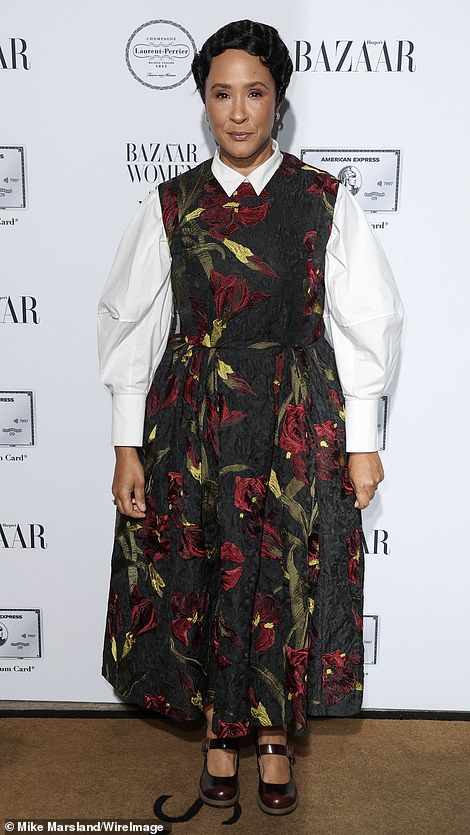 Golda Rosheuvel cut a chic figure in a floral pinafore dress and a crisp white shirt