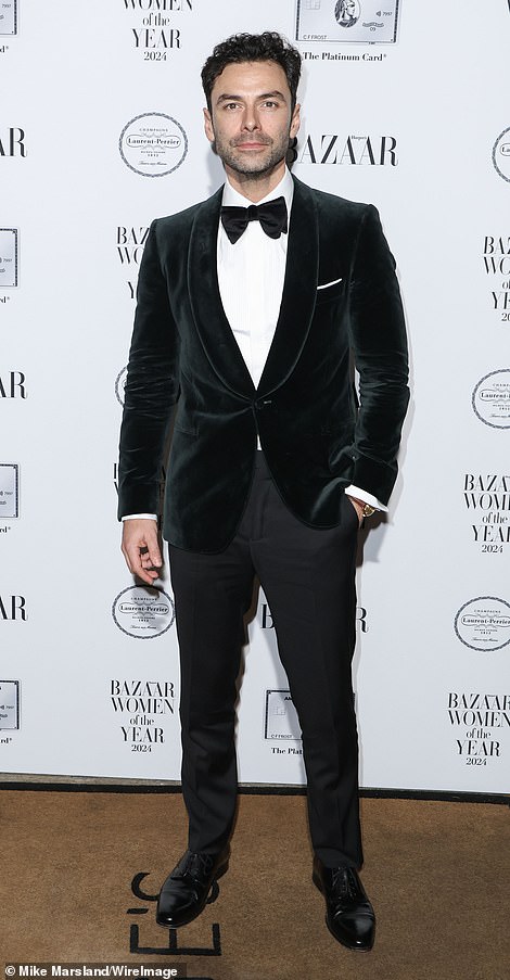 Aidan Turner suited up in a sharp black velvet blazer, after delighting fans with his role in the racy Disney+ series