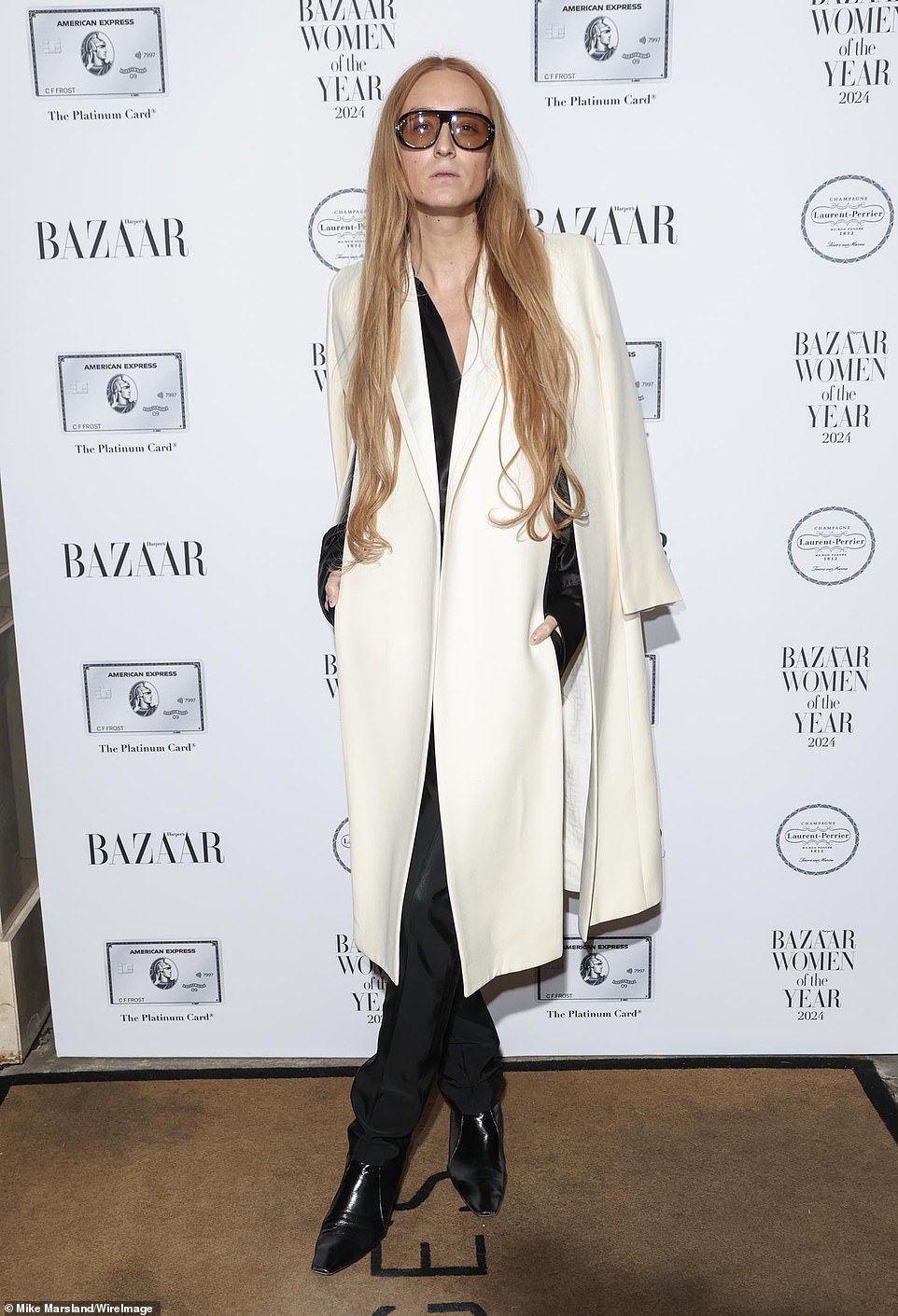 Harris Reed was dressed to impress in a white overcoat over her contrasting all-black look