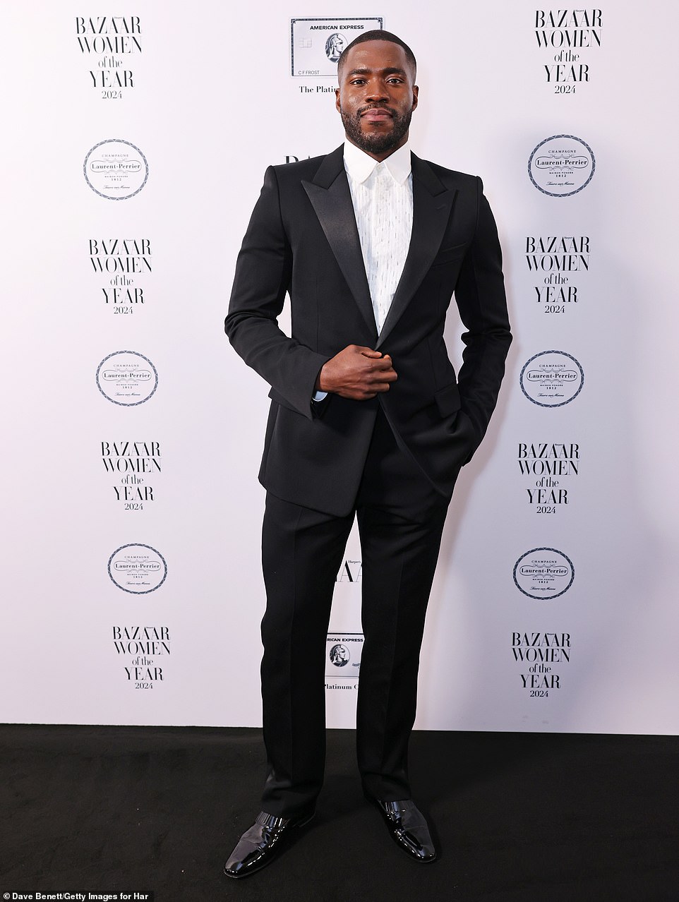 Actor Martins Imhangbe cut a suave figure in a sharp black trouser suit, teamed with a crisp white shirt