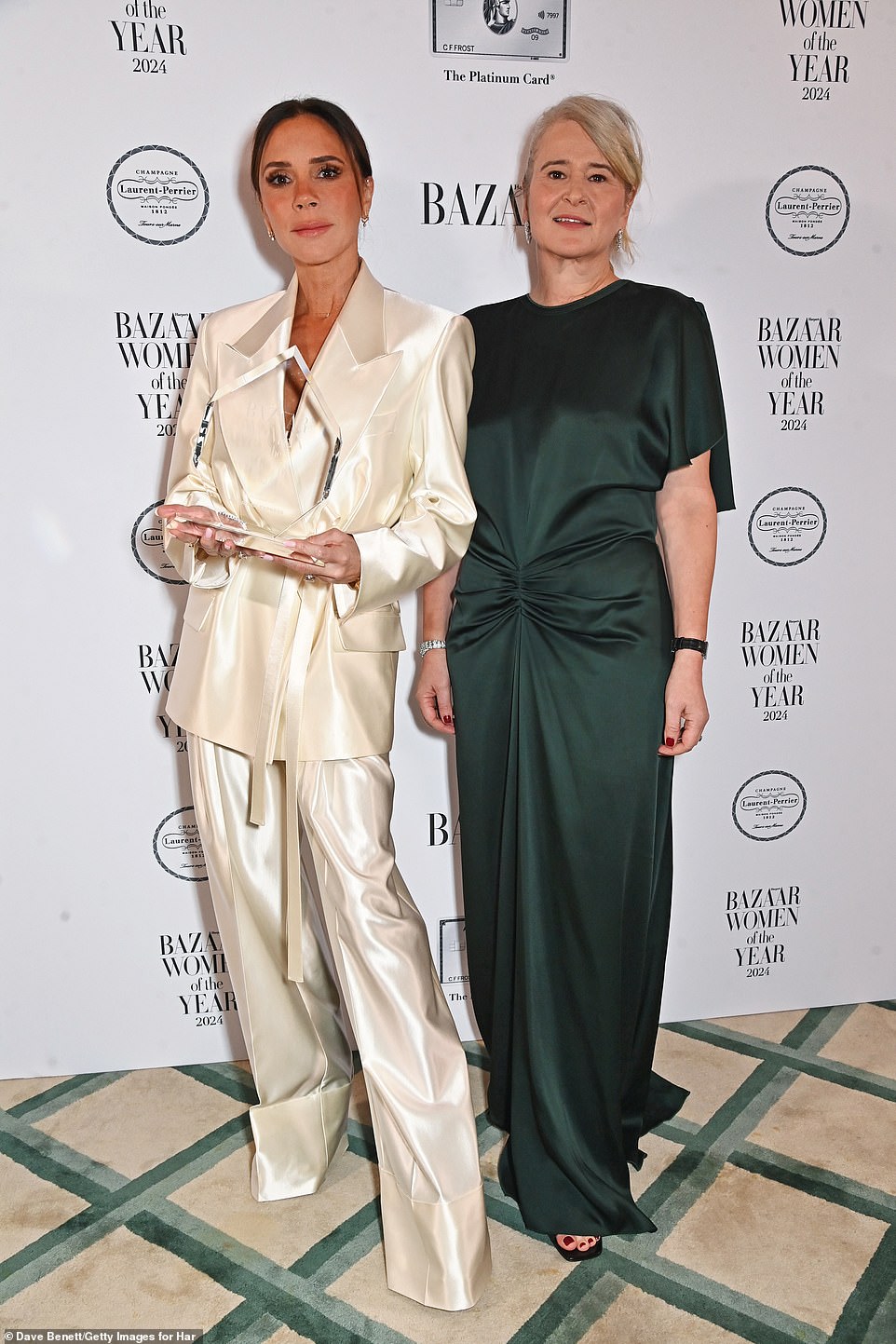 After being presented with her coveted prize, Victoria showed off her elegant look while posing for snaps with Harper's Bazaar Editor-in-Chief Lydia Slater