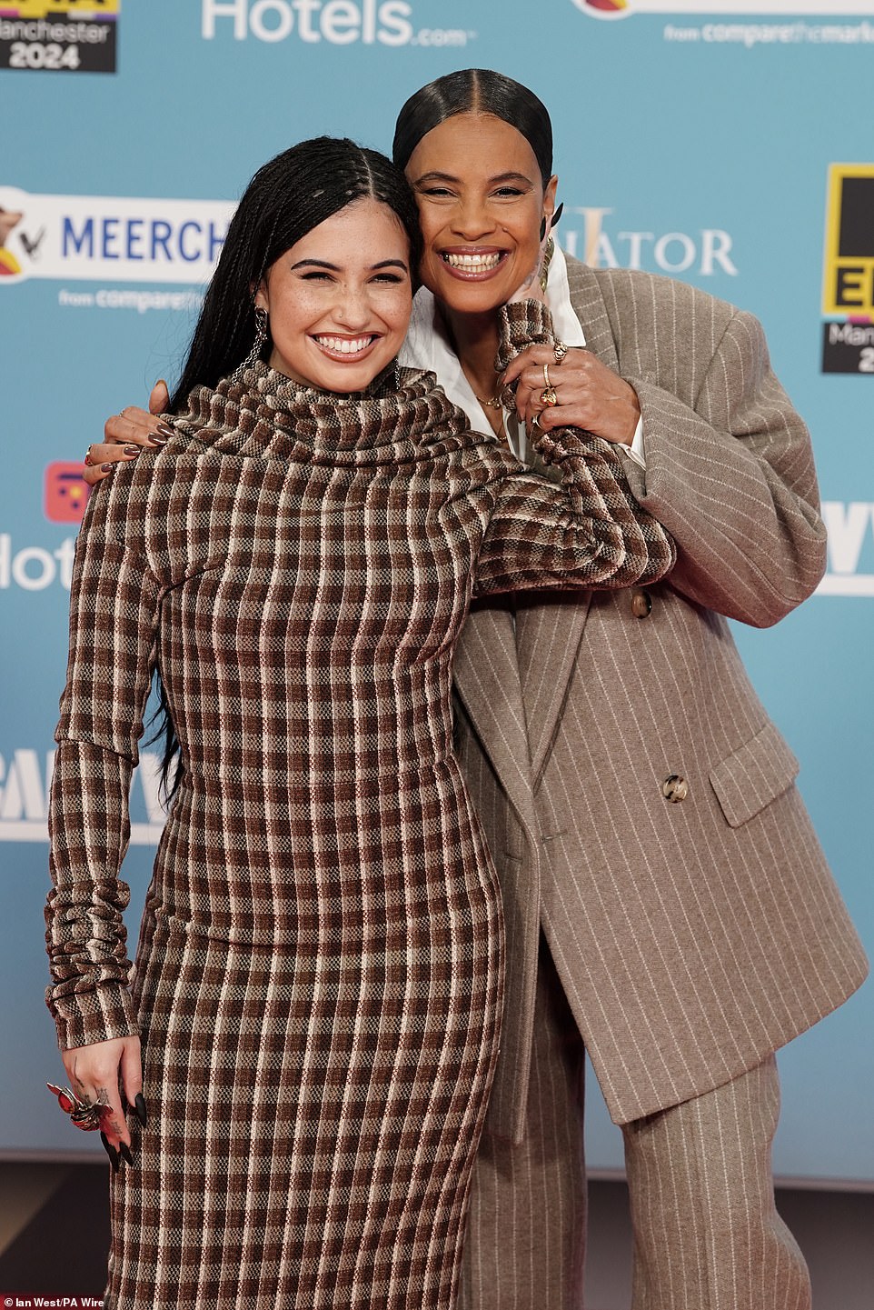 The songstress, 28, looked as stylish as ever in the high-neck number as she joined her Swedish singer mum Neneh, 60, arriving at the event