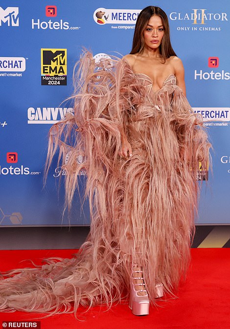 The top featured a corset style and was teamed with silk pink heels