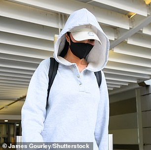 Arriving Down Under the pop star kept a low profile amid the crowds, covering her identity with a full grey tracksuit, a mask and kept her head down as she walked