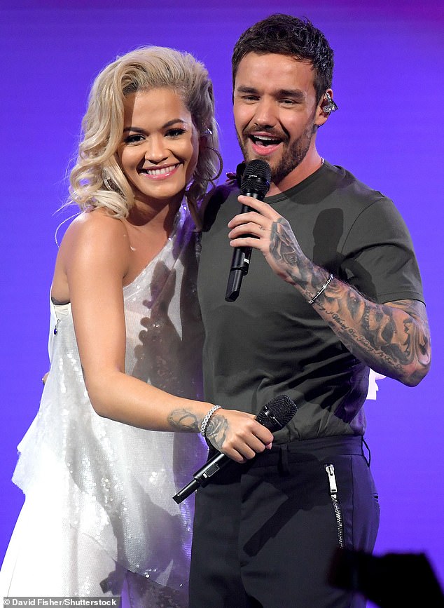Rita - who collaborated with Liam on the 2018 single 'For You' - broke down in tears as she said: 'I just want to take a moment to remember someone very, very dear to us' (seen in 2018 together)