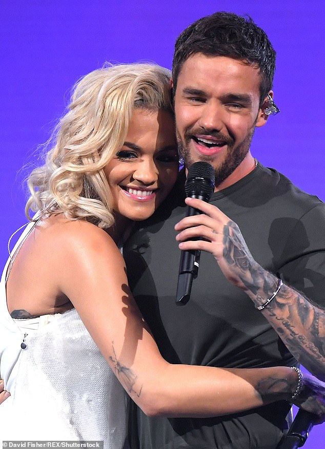 The pair are seen performing together in 2018