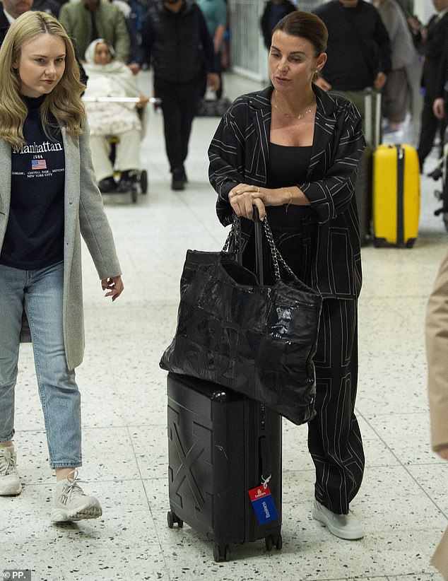 Coleen Rooney was seen checking in at the airport on Monday as she prepared for a the long flight ahead of becoming the sixth star to land in Brisbane