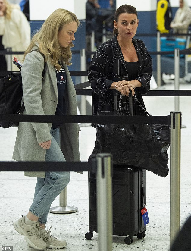 The beauty was seen carrying a chic black Chanel bag as well as her suitcase