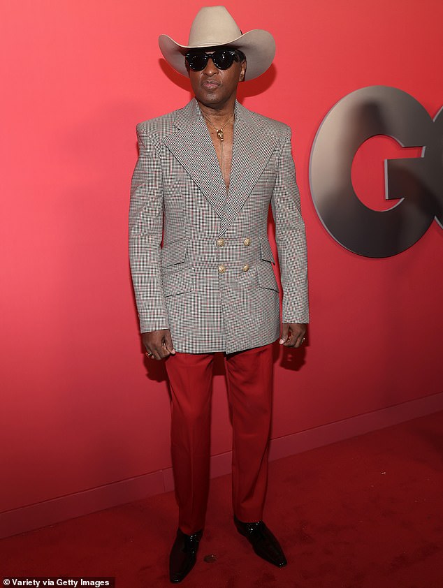 Kenneth 'Babyface' Edmonds donned a fitted, gray plaid blazer as well as a pair of red pants and a tan cowboy hat