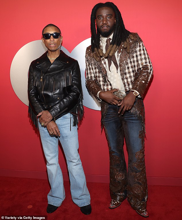 Shaboozey soon crossed paths with Pharrell Williams, who donned a pair of light blue denim jeans as well as a tasseled, black leather jacket