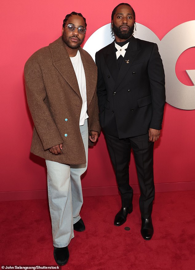 Malcolm Washington was seen on the red carpet in denim jeans and an oversized brown blazer alongside dapper John David Washington