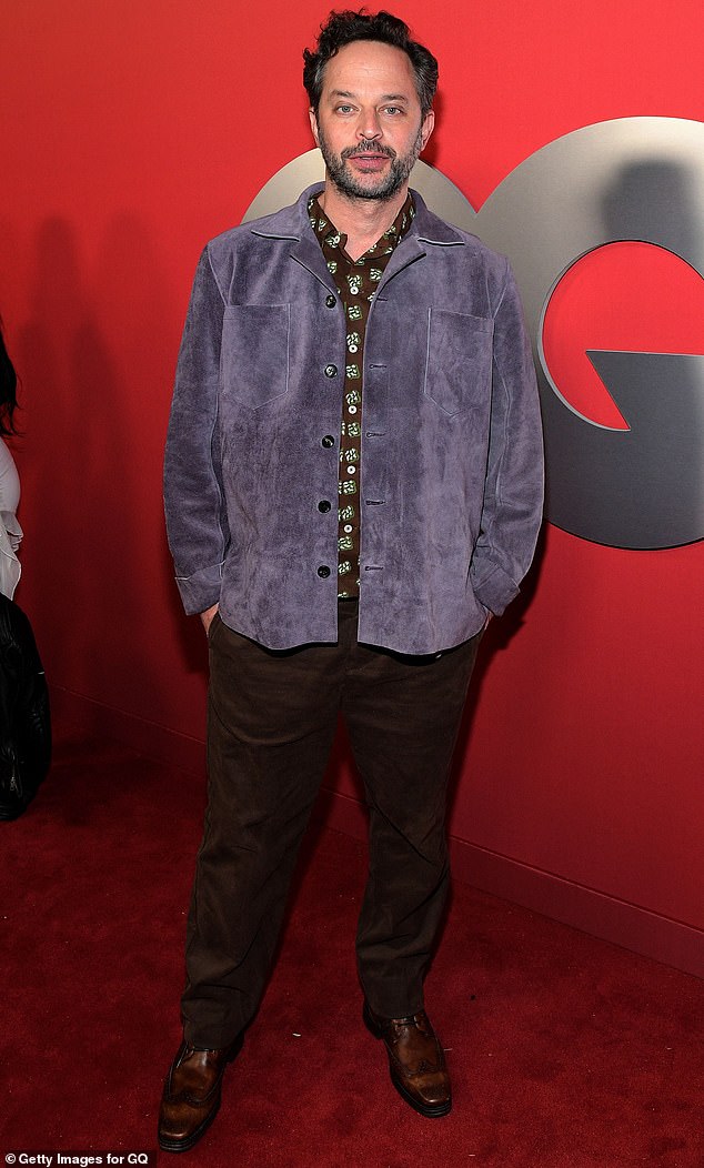 Nick Kroll sported a pair of dark brown trousers as well as a brown-patterned shirt and blue suede jacket on top