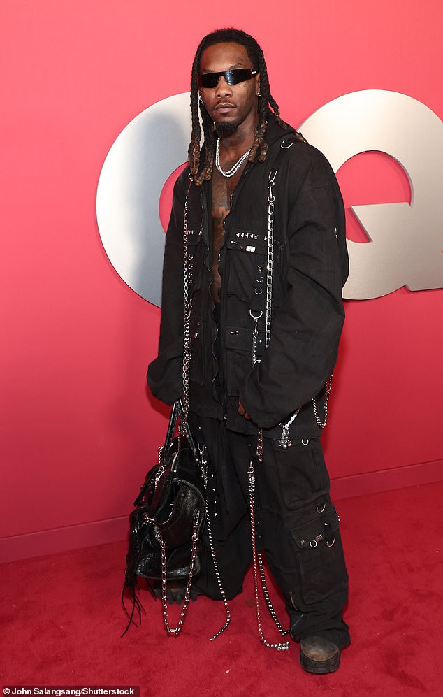 The rapper struck a few poses while also wearing a pair of chunky boots and carried a large, black duffle bag in his right hand