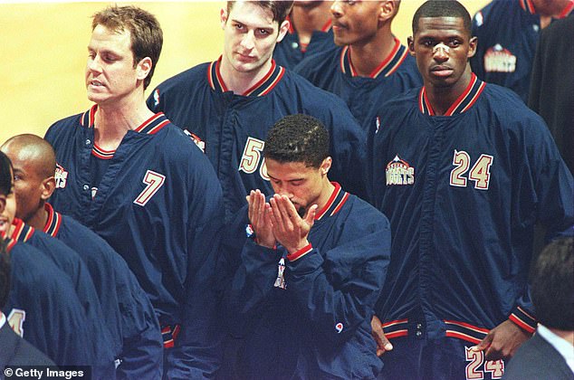 Mahmoud Abdul-Rauf stands in prayer during the singing of the anthem in 1996